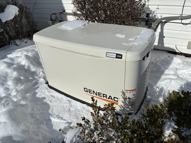 Performed diagnostic service on 31-year-old Generac residential backup generator. Battery tested using Konnwei KW208 diagnostic tool, which indicated "GOOD BATTERY" status with acceptable CCA and SOC values. Inspected unit exterior and connections, noting snow accumulation but no visible external damage. Generator failed initial inspection with red indicator light active; completed necessary adjustments and testing to restore proper functionality.