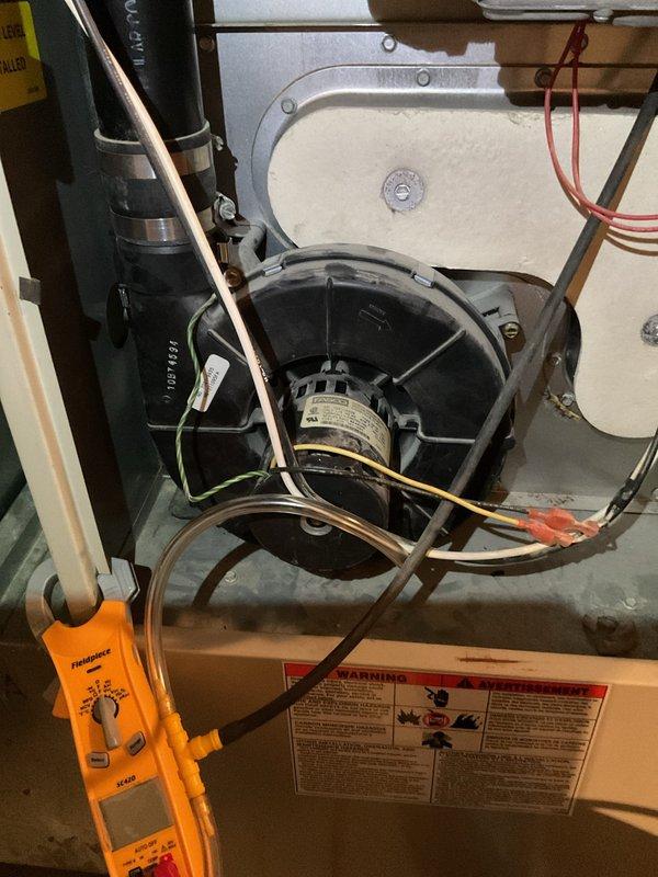Diagnosed 15-year-old furnace with no heat complaint and loud motor noise. Testing revealed a failed blower motor drawing 0.135 amps (significantly below normal operating range). Replaced blower motor assembly and verified proper system operation with normal temperature rise across heat exchanger.
