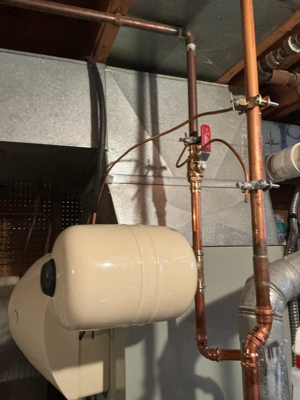 Responded to customer complaint regarding gas odor from hot water heater and improper installation concerns. Upon inspection, identified and corrected gas connection issues that were causing the leak. Installed expansion tank according to current plumbing code requirements, ensuring proper mounting and connection to the copper supply lines. System now operates safely with no gas leaks detected.