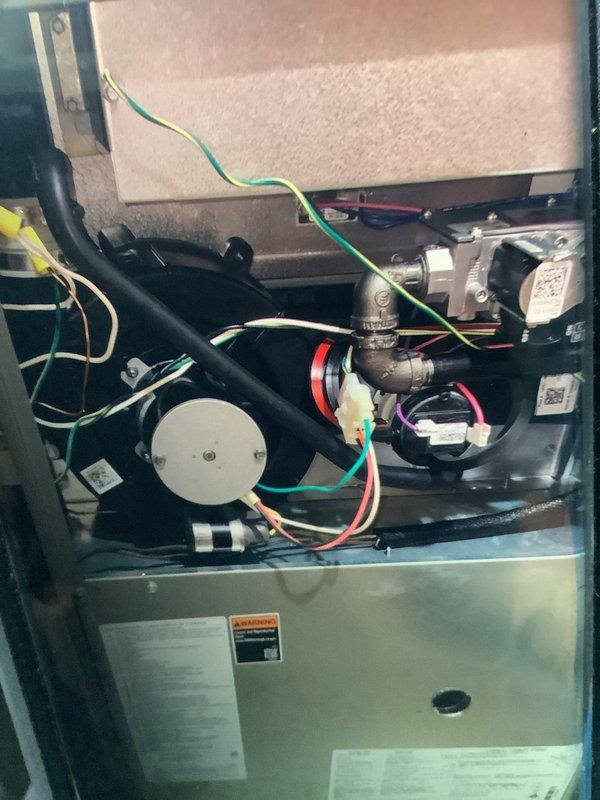 Diagnosed heating system failure caused by faulty flame sensor. Performed thorough system inspection, took temperature readings showing inadequate heat output (30.8°), and cleaned corroded flame sensor to restore proper ignition sequence. Unit now functioning correctly with consistent flame detection and proper heat output.
