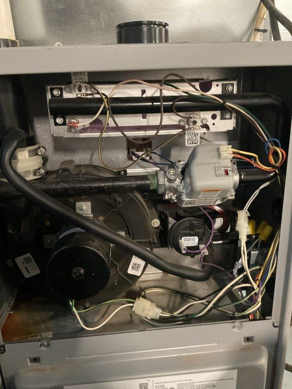 Responded to callback regarding insufficient heating issue after previous service visit on 1/8 that addressed noise concerns and included condensate pump and blower wheel cleaning. Diagnostic inspection of MVP natural gas furnace revealed improper operation of the blower motor assembly. Removed access panel, inspected wiring connections and blower components, adjusted motor settings, and verified proper operation. System now heating to set temperature with normal operation confirmed.