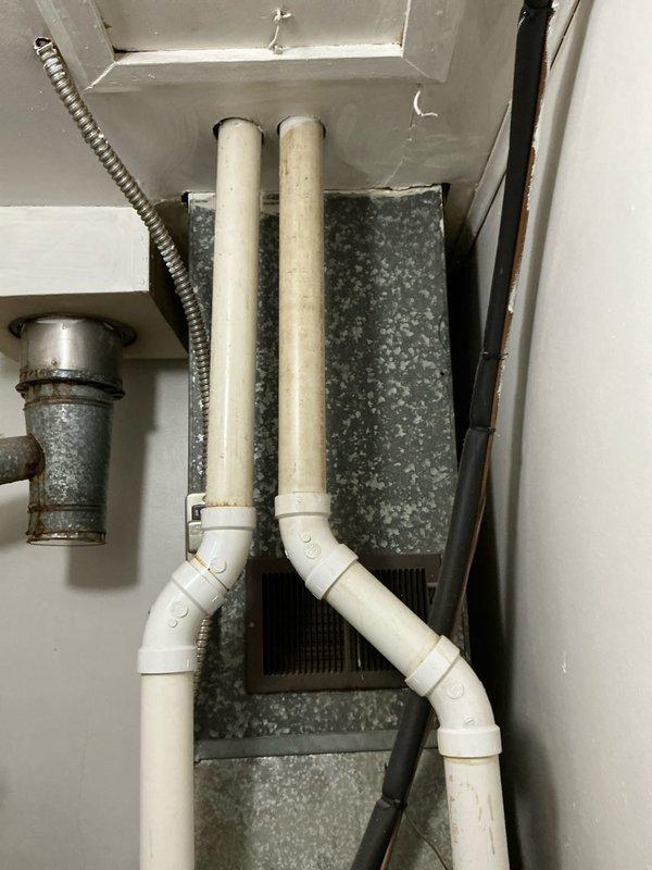 Conducted a furnace replacement estimate for customer Dan (quote #02111-01). Inspection of the existing HVAC system revealed aging PVC exhaust/intake pipes showing discoloration and wear. The installation area includes both PVC piping and metal ductwork that will need to be integrated with any new system. Photos documented the current configuration for proper replacement planning.