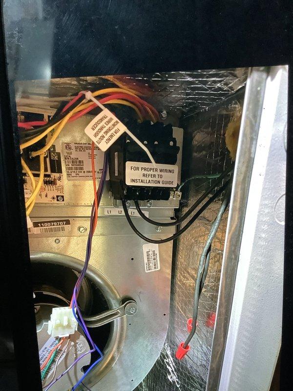 Diagnosed 4-month-old geothermal unit with auxiliary heat failure. Inspected control board connections and identified loose yellow wires at the auxiliary heat terminals. Secured connections and verified proper operation of auxiliary heating elements.