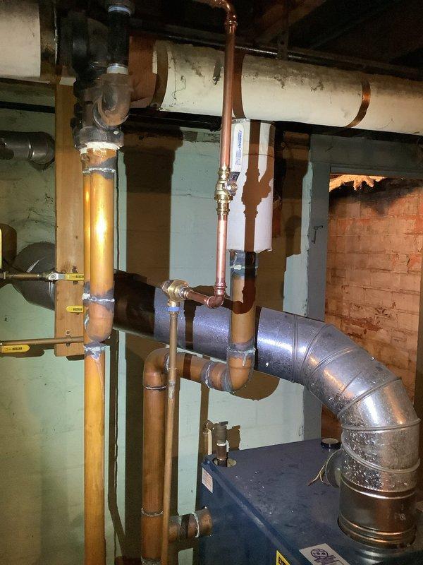 Completed replacement of both steam main vents at the end of runs before the condensate line drop points. Installed new backflow device for the boiler system, connecting from the existing galvanized fittings with new piping. Additionally, replaced two identified leaking sections in the steam boiler system.