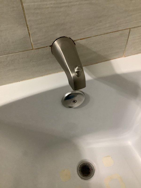 Investigated and repaired a water leak in the bathroom of a 60-year-old home. Identified deterioration in the bathtub spout diverter and shower valve assembly causing water seepage. Replaced fixture components and verified proper operation with no further leakage.