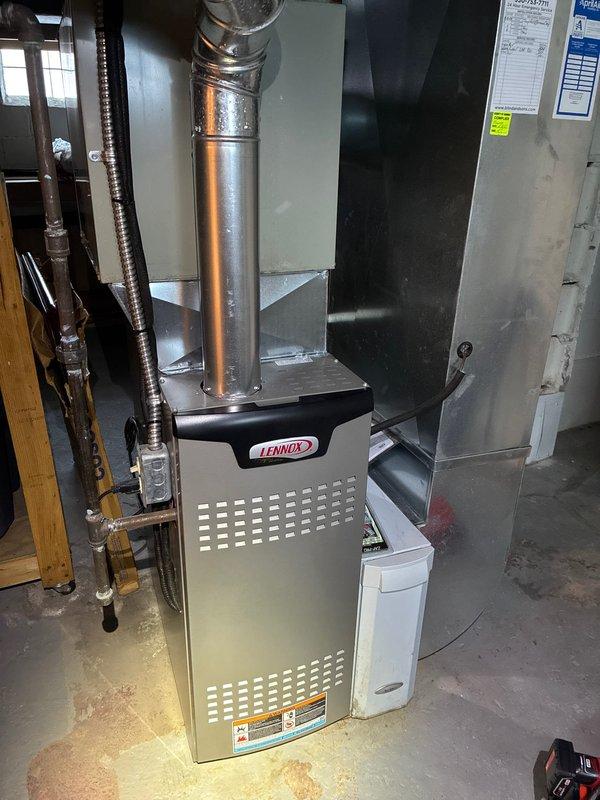 Performed scheduled heating maintenance service on a Lennox furnace system. Inspected furnace components including heat exchanger, ductwork connections, and exhaust ventilation. Identified minor corrosion on a component that was documented with photos, but system remains in proper working condition.