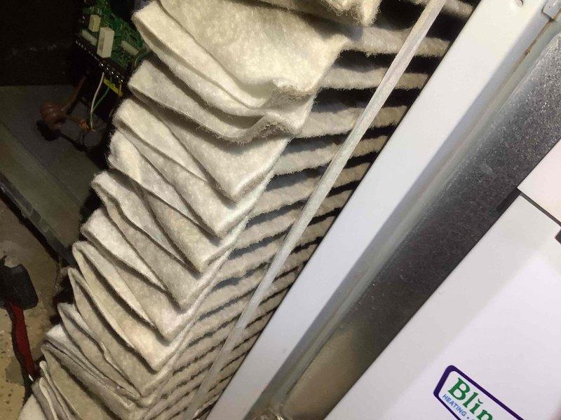 Completed scheduled heating maintenance service on 6-year-old system. Observed significant dust and debris accumulation on pleated air filter requiring replacement. Noted rust formation on internal components and dust buildup on electrical connections, indicating need for thorough cleaning to maintain system efficiency and prevent potential component failure.