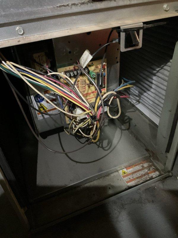 Responded to customer complaint of burning smell and non-functioning furnace blower. Upon inspection of the Trane XR80 unit (approximately 10 years old), discovered snow blockage in the chimney vent and electrical issues on the control board. Cleared the vent obstruction and repaired faulty wiring connections, restoring proper blower function and heat distribution. System now operating normally with no burning odor detected.