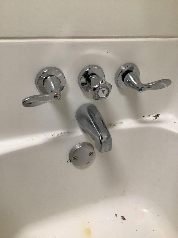 Installed new Moen 3-handle shower valve with mixing valve and ball valves after confirming parts delivery. Additionally installed customer-supplied toilet. Accessed plumbing through wall panel to complete proper connections to existing copper pipe system.
