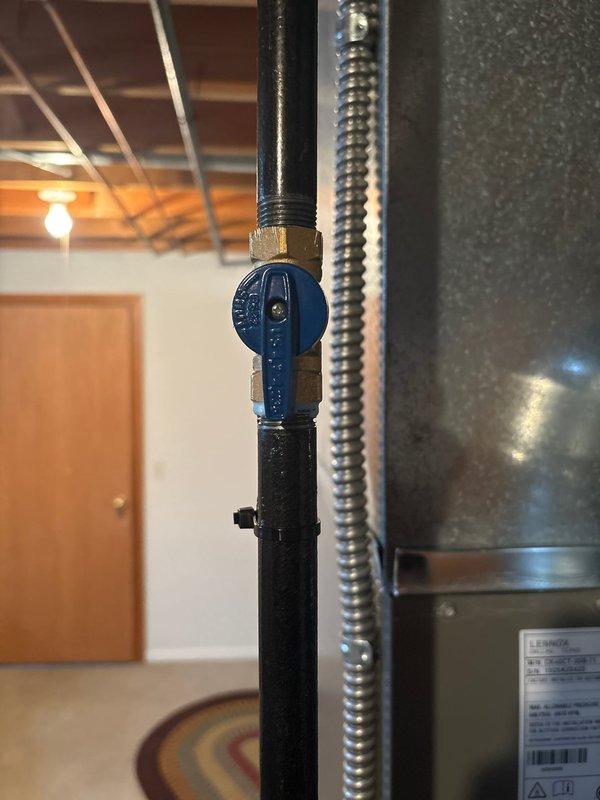 Successfully installed a complete 80% furnace and air conditioning system. Installation included proper gas line configuration with shutoff valve and flexible connection to the furnace. Mounted air handler unit with appropriate ductwork connections in the utility area.