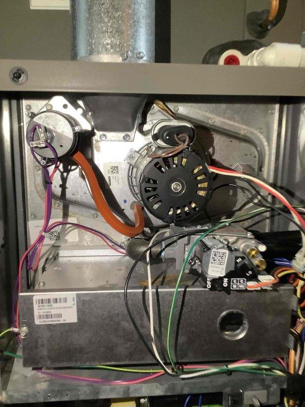 Performed routine maintenance cleaning on 7-year-old heating system. Inspected and cleaned internal components including blower motor assembly and control board. Verified proper electrical connections on circuit board with all colored wiring intact and secure. System returned to normal operating condition.