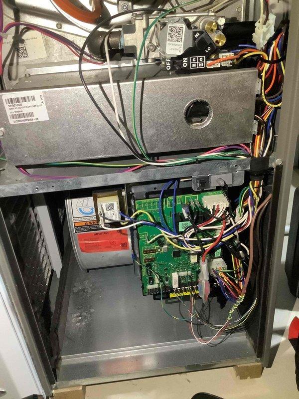 Performed routine maintenance cleaning on 7-year-old heating system. Inspected and cleaned internal components including blower motor assembly and control board. Verified proper electrical connections on circuit board with all colored wiring intact and secure. System returned to normal operating condition.
