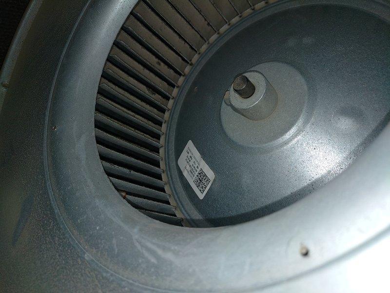 Performed diagnostic inspection on furnace with unknown age. Identified significant dust accumulation on blower wheel assembly requiring cleaning. Discovered structural crack in heat exchanger during inspection, indicating potential safety hazard and need for replacement.