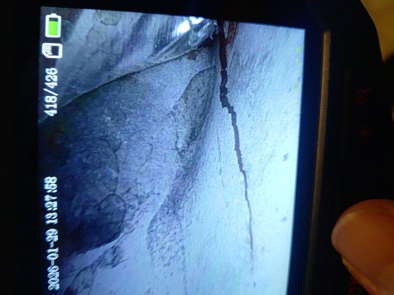 Performed diagnostic inspection on furnace with unknown age. Identified significant dust accumulation on blower wheel assembly requiring cleaning. Discovered structural crack in heat exchanger during inspection, indicating potential safety hazard and need for replacement.