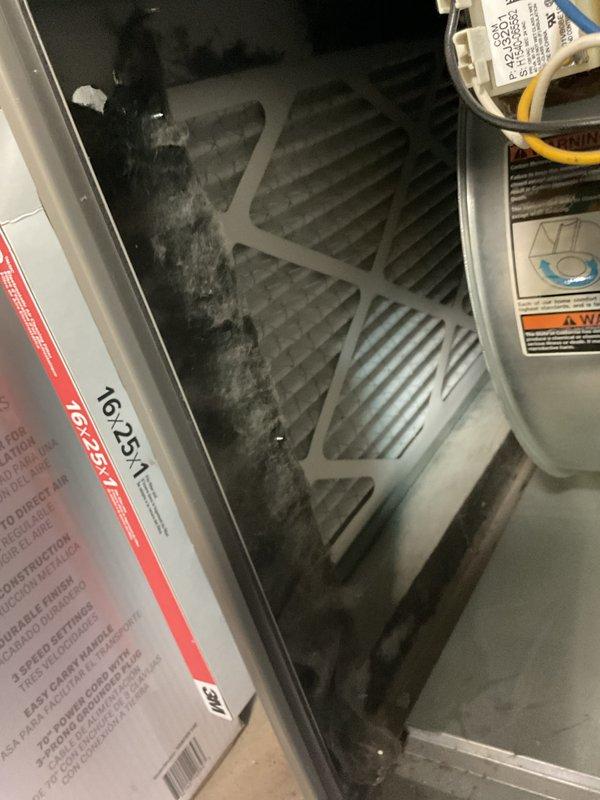 Performed routine MVP Heating Visit and discovered severely clogged 16x25x1 air filter with heavy dust accumulation, restricting proper airflow through the system. Conducted temperature testing of supply lines using a probe instrument to verify system operation after replacing the filter.