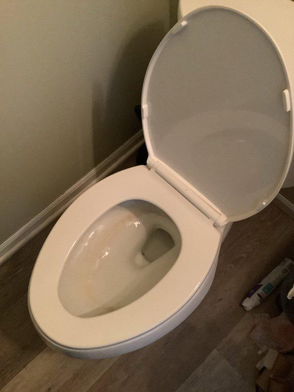 Responded to service call regarding multiple toilets experiencing drainage, filling issues, and bubbling. Inspected plumbing system and located black PVC drainage pipe with connection joints in utility area. Resolved drainage problems by clearing blockage in main waste line, restoring normal toilet operation throughout residence.