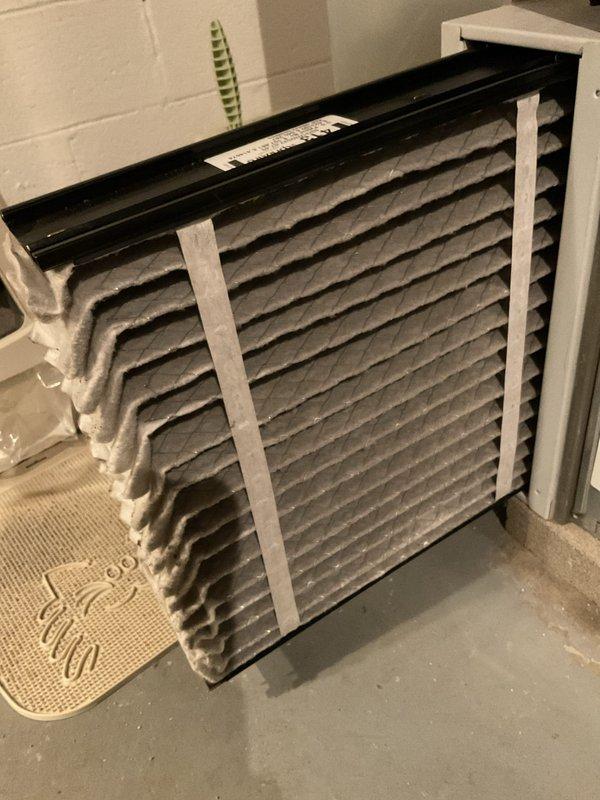 Performed routine maintenance on heating system. Inspected and replaced air filter which showed significant dust accumulation. Used hex key tool to access system components and complete standard maintenance procedures.