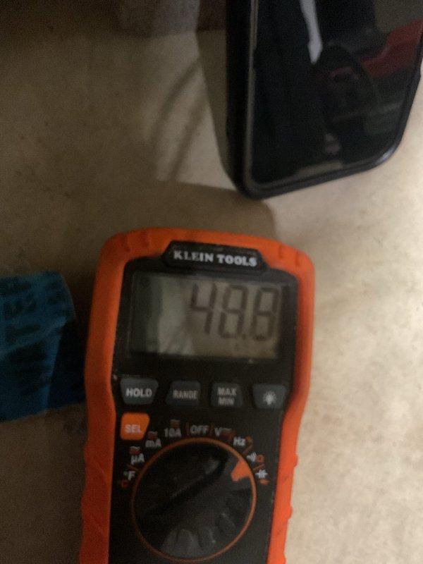 Performed scheduled furnace tune-up service, which included comprehensive system testing with multimeter readings confirming proper voltage at 48.6V. Inspected ductwork to assess cleaning requirements and evaluated furnace connections, noting some wear on plumbing components near the unit. System is functioning within normal parameters after service completion.