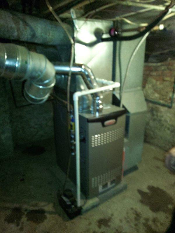 Successfully installed a new 80% efficiency Lennox furnace with complete ductwork connection in basement utility area. System includes an integrated UV lamp for improved air quality. All connections properly secured and system tested for optimal performance.