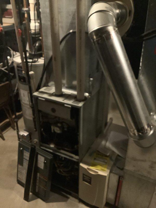 Successfully completed installation of a 90% efficient furnace in basement utility area. System features proper ductwork connections and PVC venting components. All equipment was properly positioned and secured with connections to existing mechanical systems.