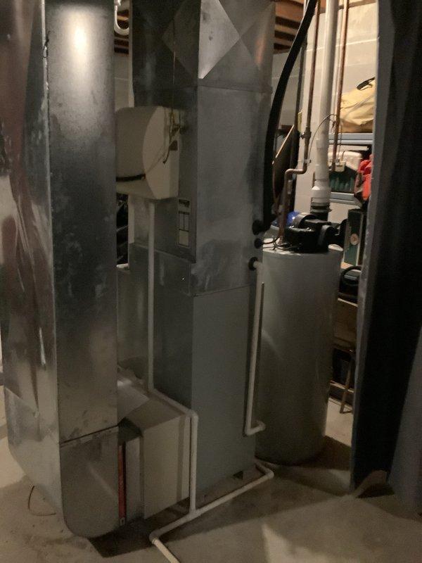 Successfully completed installation of a 90% efficient furnace in basement utility area. System features proper ductwork connections and PVC venting components. All equipment was properly positioned and secured with connections to existing mechanical systems.