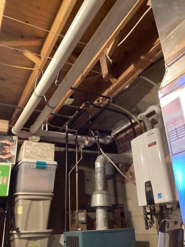 Performed comprehensive tune-up on 4-year-old furnace. Inspected internal electrical components including control board, wiring connections, and transformer. Examined ventilation system including PVC pipes and metal ductwork in basement utility area. All systems functioning properly after service.