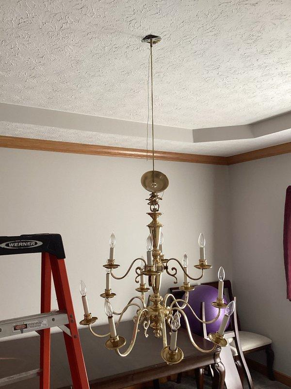 Inspected customer's chandelier that was reported to be hanging lower than usual. Upon examination, verified chandelier position and checked mounting hardware and ceiling attachment points. No electrical issues found with the fixture. Secured chandelier properly to restore correct hanging height and ensure safe operation.