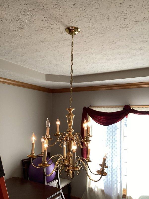 Inspected customer's chandelier that was reported to be hanging lower than usual. Upon examination, verified chandelier position and checked mounting hardware and ceiling attachment points. No electrical issues found with the fixture. Secured chandelier properly to restore correct hanging height and ensure safe operation.