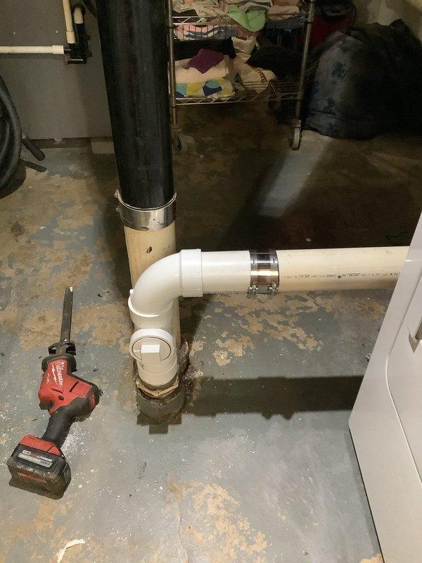 Removed broken 3" PVC male adapter from main cleanout and rebuilt the affected section of pipe. Snake was run through the drain to clear backup before reconstructing the PVC pipe section, resolving the water backup issue at the base of the stack. New PVC installation includes proper pressure-rated fittings with clean-out access.