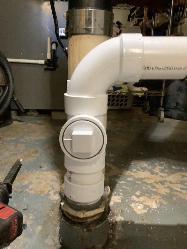 Removed broken 3" PVC male adapter from main cleanout and rebuilt the affected section of pipe. Snake was run through the drain to clear backup before reconstructing the PVC pipe section, resolving the water backup issue at the base of the stack. New PVC installation includes proper pressure-rated fittings with clean-out access.