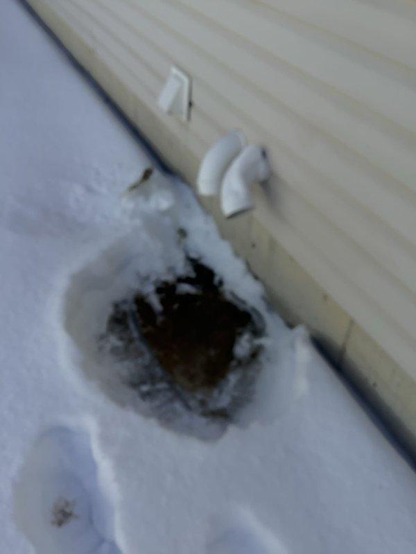 Responded to no heat call for 20-year-old gas furnace. Discovered complete blockage of intake/exhaust pipe due to ice formation during extreme cold conditions. Removed ice obstruction, restored proper ventilation, and verified furnace operation. System now functioning normally with proper combustion air flow.