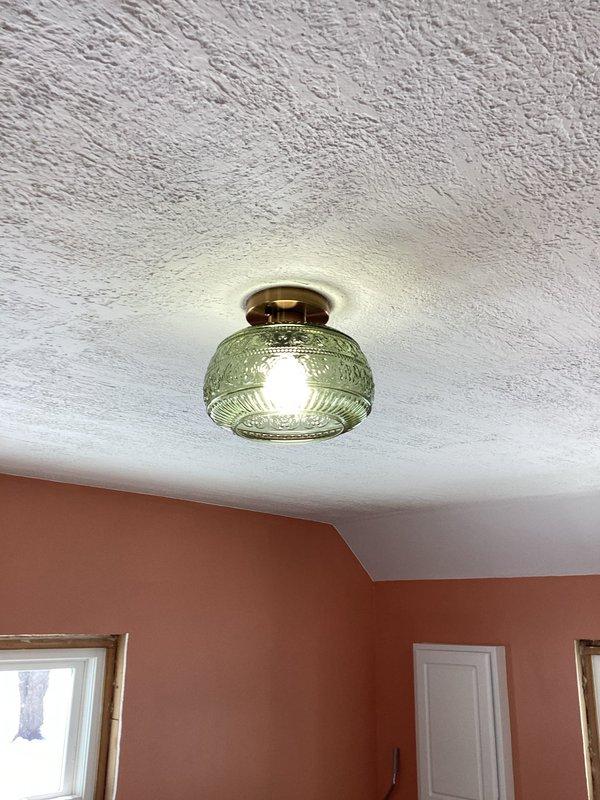 Responded to warranty service call regarding malfunctioning overhead light. Installed a 3-way switch on wall to restore proper functionality to the decorative glass pendant fixture. Provided customer with pricing options for additional outlet installations as requested.