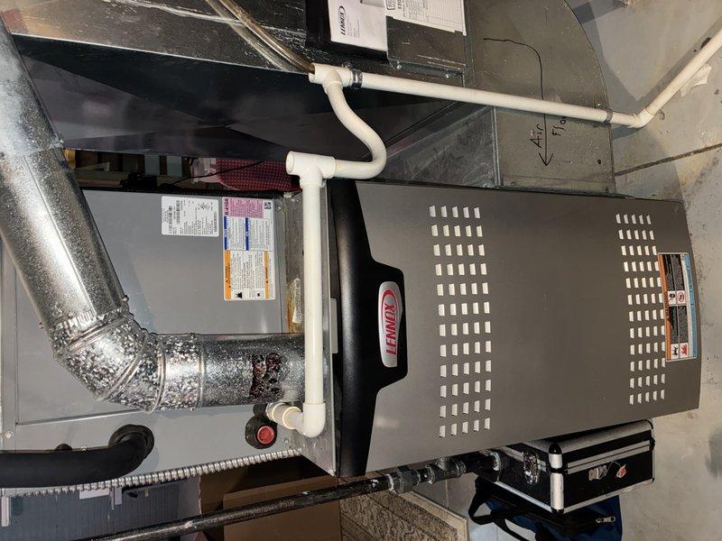 Performed comprehensive MVP heating maintenance on 5-year-old Lennox furnace system. Inspected all components including ductwork connections and condensate drainage system with PVC piping. Checked and verified proper operation of gas supply ball valve with red handle. System is functioning within normal parameters.