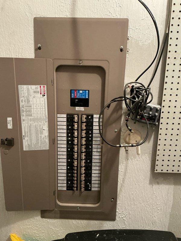 Conducted generator installation estimate for HOA-approved project. Inspected existing electrical panel capacity and exterior utility area to determine appropriate generator placement near AC unit and gas meter. Photos documented current electrical panel configuration and exterior space for proper planning and installation requirements.