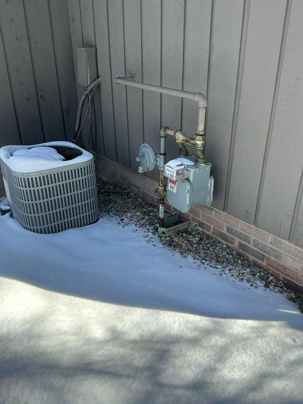 Conducted generator installation estimate for HOA-approved project. Inspected existing electrical panel capacity and exterior utility area to determine appropriate generator placement near AC unit and gas meter. Photos documented current electrical panel configuration and exterior space for proper planning and installation requirements.