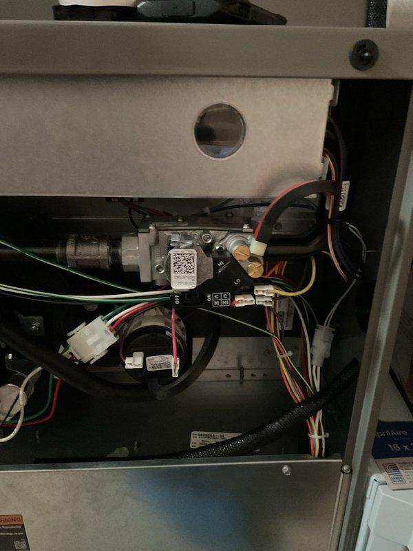 Responded to customer call for no heat with urgent warning displayed on thermostat. Diagnosed faulty control board and gas valve assembly. Replaced defective components, reconnected wiring harnesses, and verified proper system operation, restoring heat function.