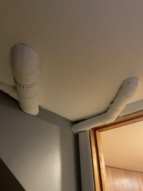 Responded to service call for suspected frozen pipes causing water leakage from wall containing washer supply lines in a 75-year-old residential property. Inspection revealed no frozen pipes, but rather loose connections at the washing machine hookup box where hot and cold braided stainless steel supply lines connect. Repaired and secured connections, eliminating the leak.