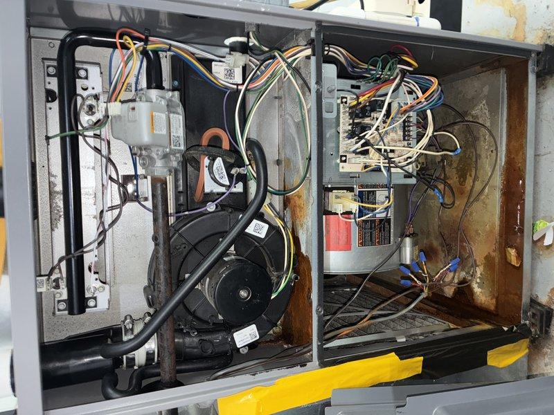 Diagnosed furnace issue presenting with loud humming noise from inducer motor and improper heating cycle. Inspection revealed significant rust and wear on internal components, with particular deterioration around the inducer assembly. Cleaned electrical connections on control board and verified proper wiring configuration. Restored normal operation with appropriate flame sequence and heat production.