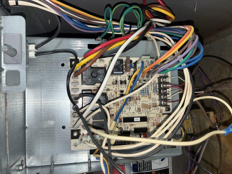 Diagnosed furnace issue presenting with loud humming noise from inducer motor and improper heating cycle. Inspection revealed significant rust and wear on internal components, with particular deterioration around the inducer assembly. Cleaned electrical connections on control board and verified proper wiring configuration. Restored normal operation with appropriate flame sequence and heat production.