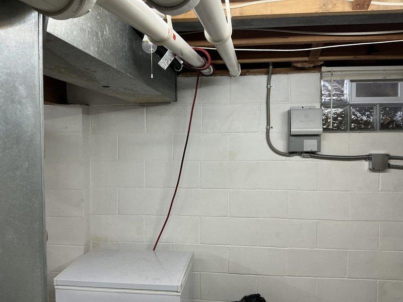 Performed HVAC system replacement including installation of an Armstrong Air furnace with proper PVC ventilation system in the utility room. Mounted unit securely with yellow brackets against concrete block wall and connected to existing ductwork. Completed electrical connections and ensured proper integration with household systems.