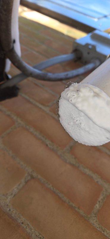 Responded to second service call for customer experiencing repeated heating failures across multiple units. Identified identical failure points in two systems, with the third unit at risk. Applied thermal sealant to exposed pipe connection and inspected exterior vent pipe showing significant ice buildup and exhaust blockage. Ordered replacement parts for both failed units; customer has been escalated to management due to extended parts delay.