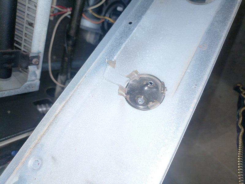 Responded to no-heat call for 25-year-old furnace. Inspection revealed severely damaged ignition assembly with heat deterioration and a malfunctioning pressure switch. Replaced both components, cleaned system, and verified proper operation to restore heating function.