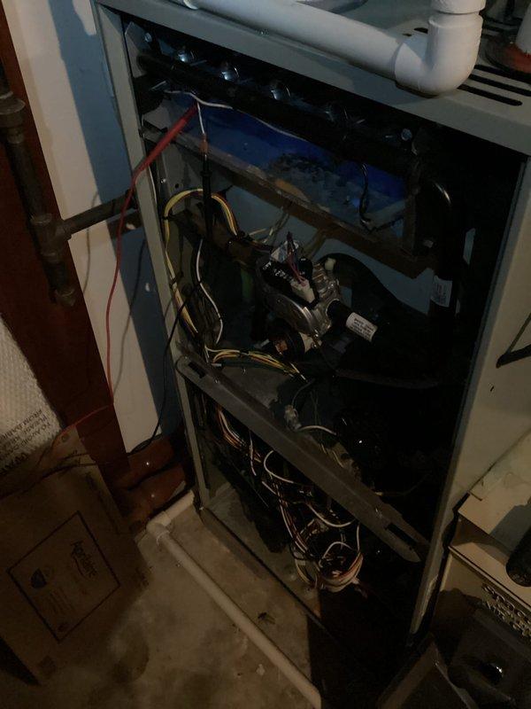 Performed diagnostic service on dual-system HVAC setup where one unit was malfunctioning with intermittent shutdowns. Removed access panel to inspect internal components and wiring connections. Conducted electrical testing with multimeter, recording voltage readings of approximately 135V. Identified and resolved issue causing system to cycle off prematurely.