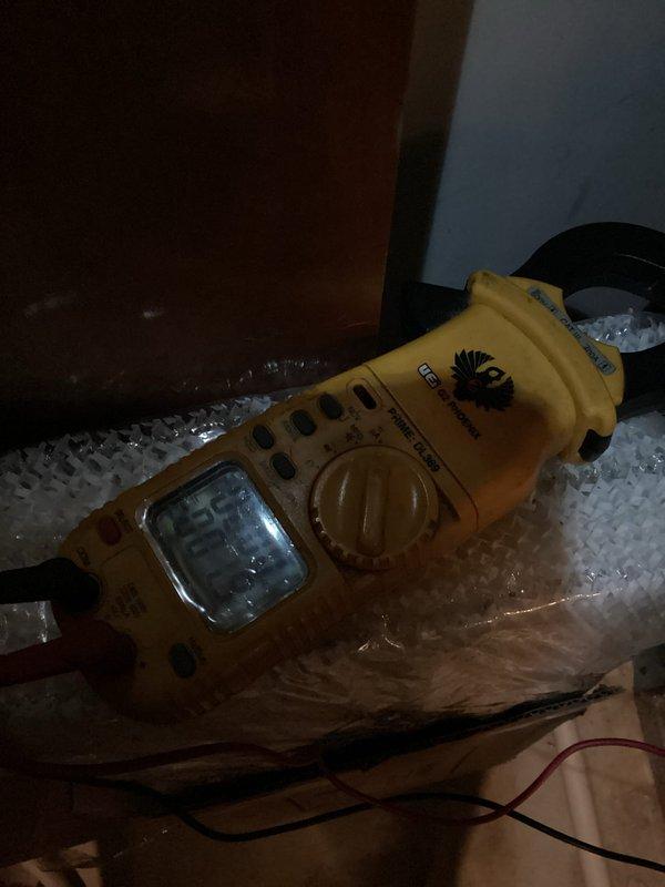 Performed diagnostic service on dual-system HVAC setup where one unit was malfunctioning with intermittent shutdowns. Removed access panel to inspect internal components and wiring connections. Conducted electrical testing with multimeter, recording voltage readings of approximately 135V. Identified and resolved issue causing system to cycle off prematurely.