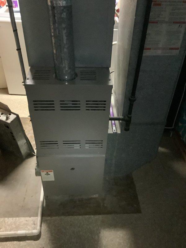 Installed 80% furnace unit and evaporator coil in customer's basement, with temperature verification confirming proper system operation (109.41°F). Outdoor condensing unit installation scheduled for spring completion when weather permits.