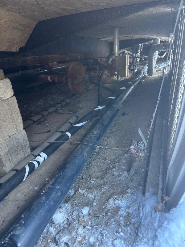 Responded to service call for heat tape replacement in crawlspace. Inspected existing installation in confined area with exposed plumbing and mechanical components. Customer currently has no water service. Replaced damaged heat tape on insulated pipes to restore proper freeze protection system functionality.