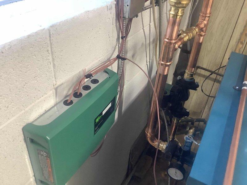 Successfully completed installation of a new boiler system with comprehensive copper piping network. Installed a Bradford White water heater alongside the primary boiler unit, ensuring proper connection of all valves, joints, and fittings. Mounted control box with multiple ports and installed circulation pump with pressure gauge for optimal system performance.