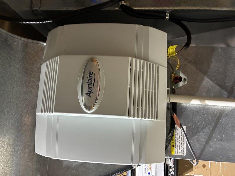 Responded to MVP customer call regarding non-functioning Aprilaire humidifier. Inspected unit mounted to HVAC system and found issue with water supply connection. Serviced the brass fitting connecting to copper supply line, restoring proper water flow to the humidifier. System tested and confirmed operational with appropriate relative humidity levels.
