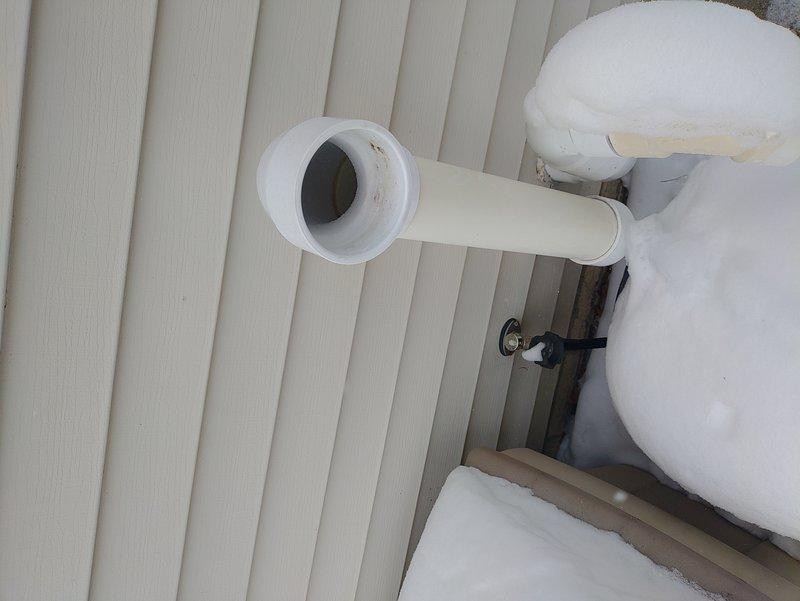 Responded to urgent no heat call for 10+ year old furnace with house temperature at 43°F. Diagnostic inspection revealed exhaust and intake PVC pipes completely obstructed by heavy snow accumulation, preventing proper combustion air flow and causing safety shutdown. Cleared all snow blockages from ventilation system, verified proper operation of pressure switches, and restored heat function. System now operating within normal parameters.