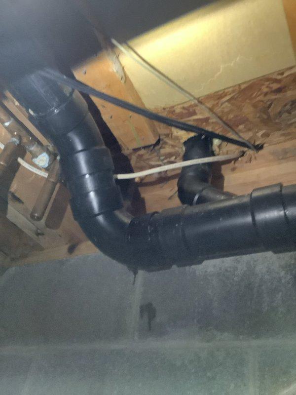 Responded to water leak service call based on customer referral. Upon inspection, identified improper washing machine drainage setup with inadequate connection to wall drain box. Confirmed no issues with main drain line; leak originated from washing machine drain hose displacement during operation. Properly secured drain hose to prevent future water spillage.